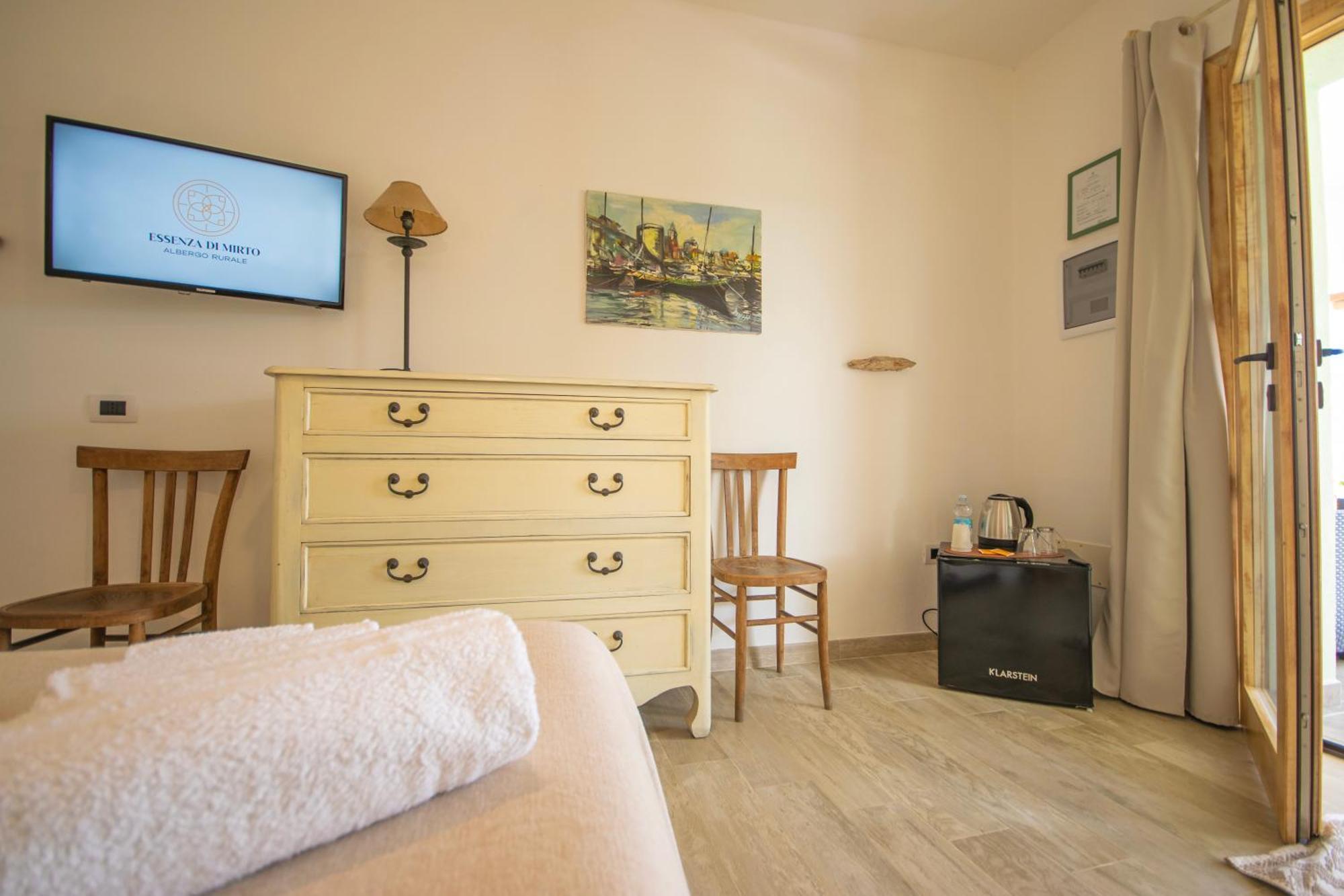 Hotel Essenza Di Mirto La Caletta Bilik gambar