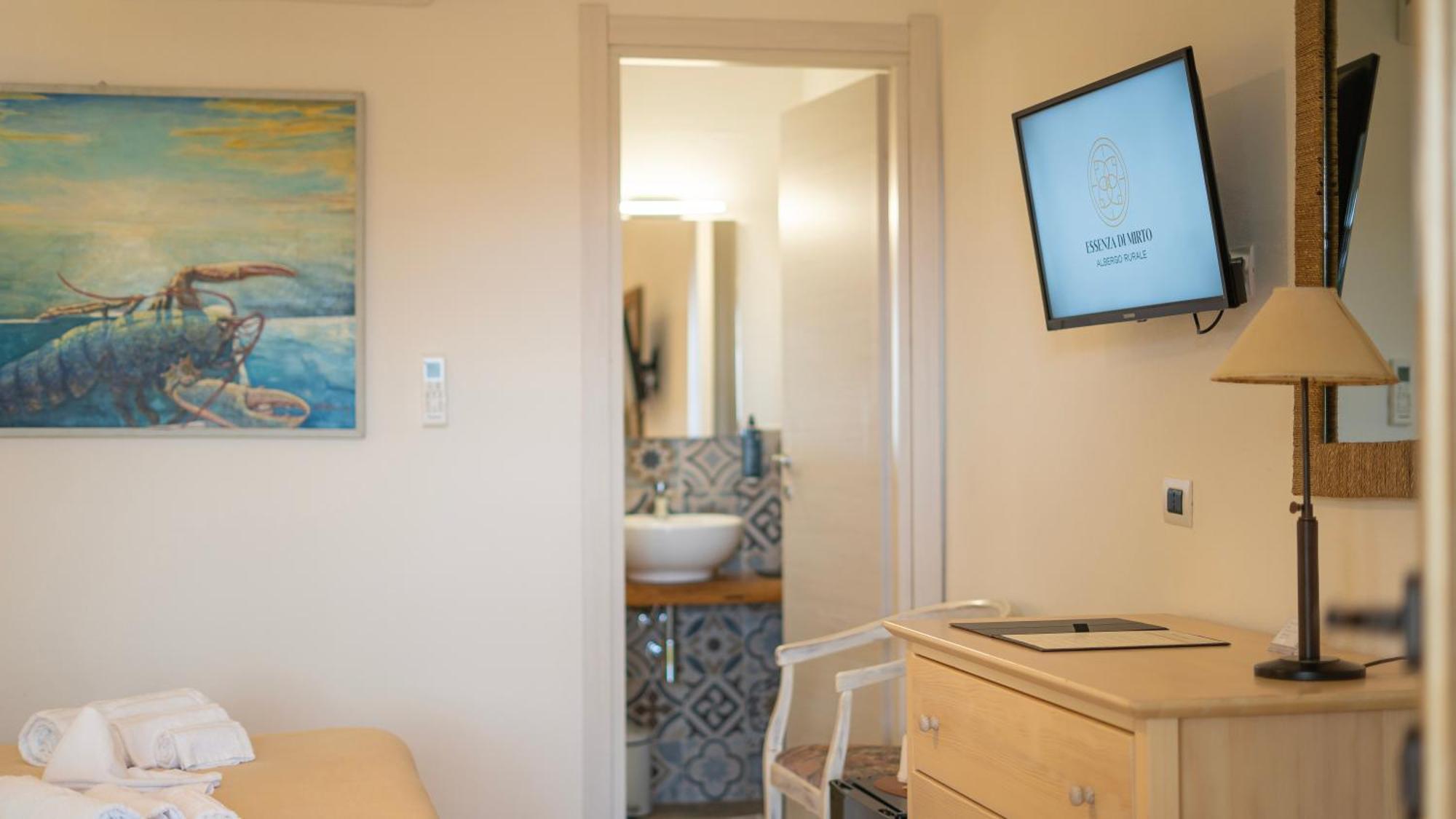 Hotel Essenza Di Mirto La Caletta Bilik gambar