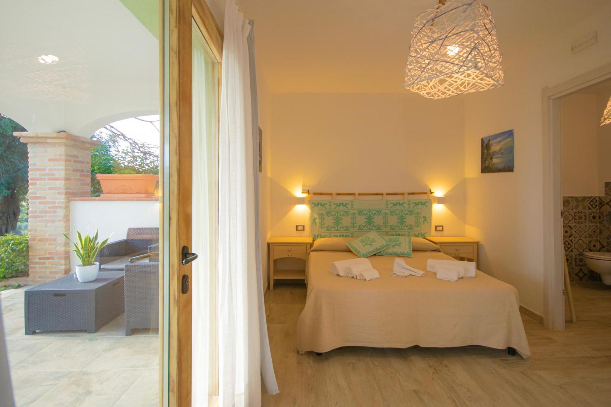 Hotel Essenza Di Mirto La Caletta Bilik gambar